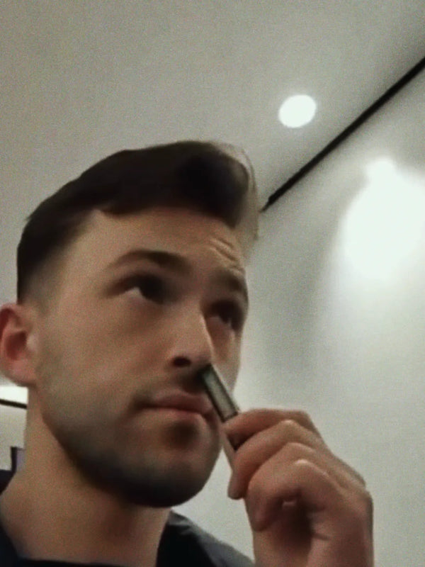 Inhale Club customer using a nasal inhaler