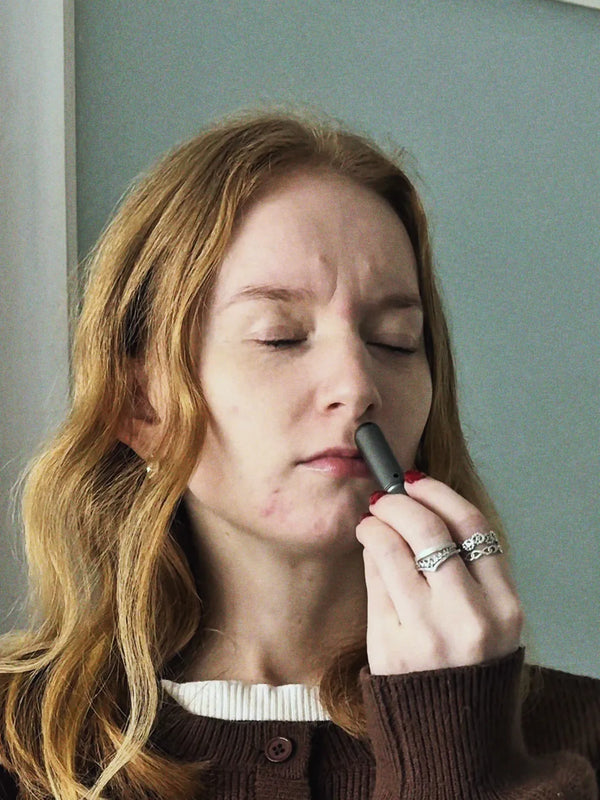 Inhale Club customer using a nasal inhaler