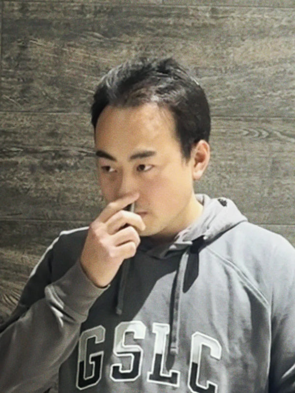 Inhale Club customer using a nasal inhaler