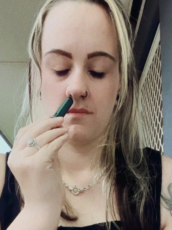 Inhale Club customer using a nasal inhaler