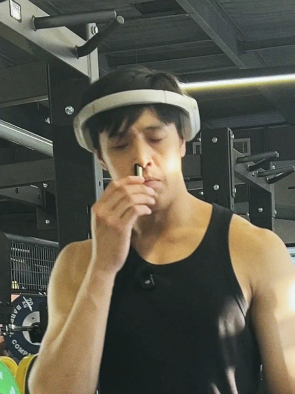 Inhale Club customer using a nasal inhaler