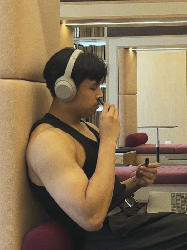 Inhale Club customer using a nasal inhaler