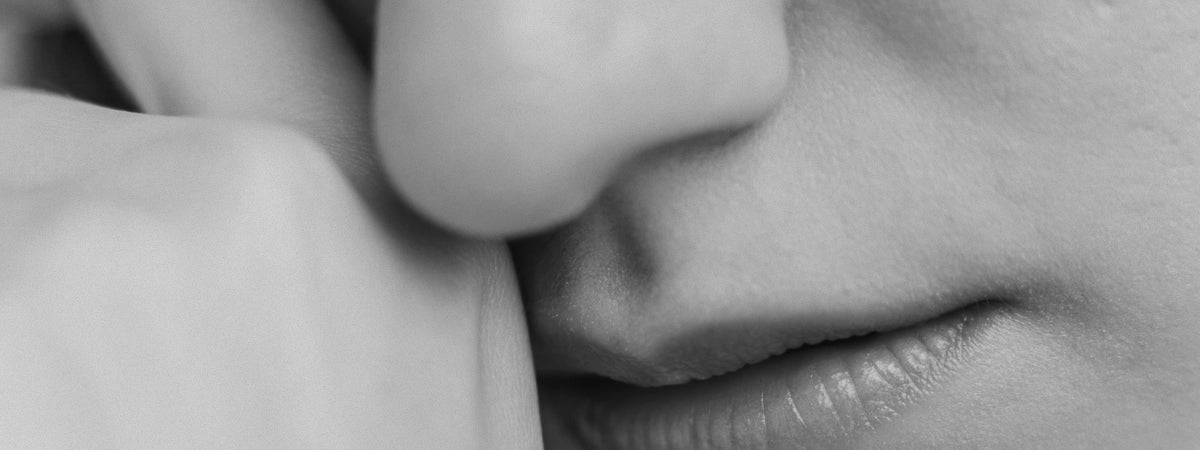 Close-up of a person's nose and mouth at rest, black and white