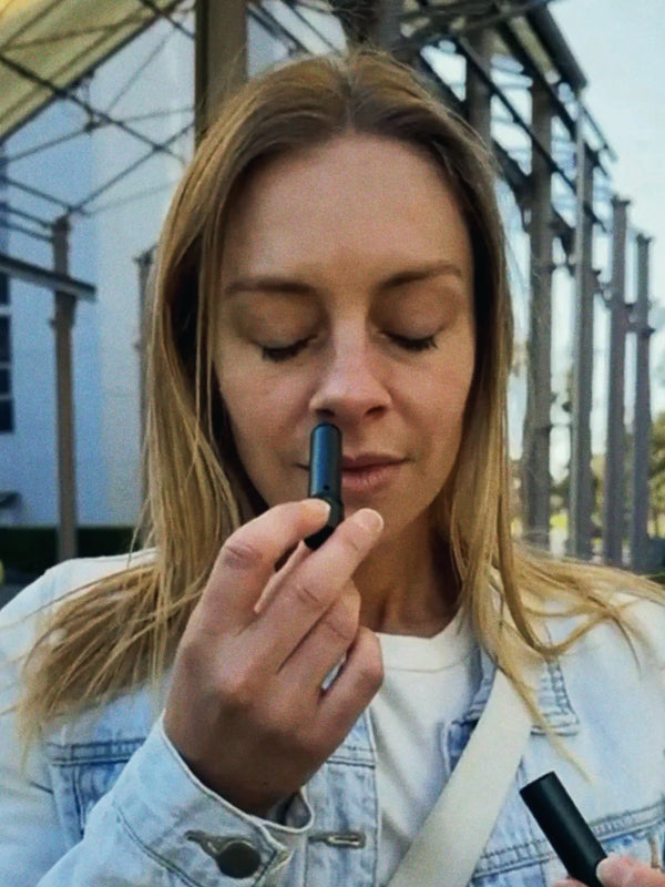 Inhale Club customer using a nasal inhaler