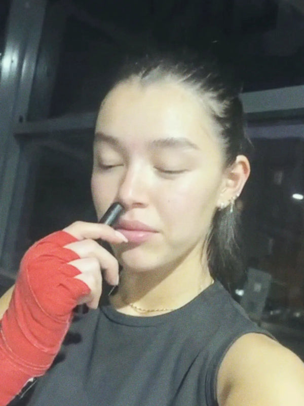 Inhale Club customer using a nasal inhaler