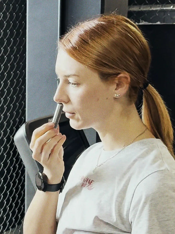 Inhale Club customer using a nasal inhaler