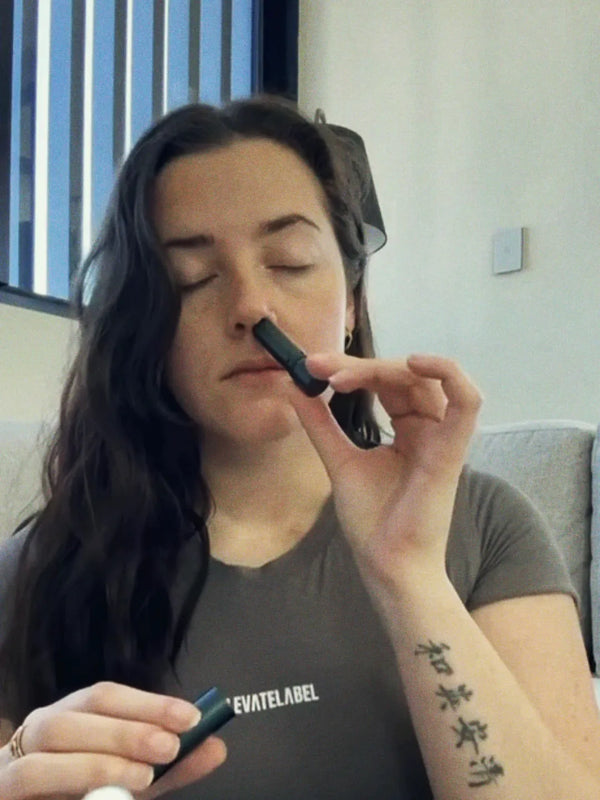 Inhale Club customer using a nasal inhaler