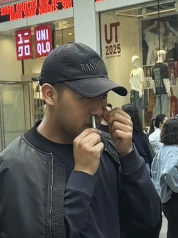 Inhale Club customer using a nasal inhaler