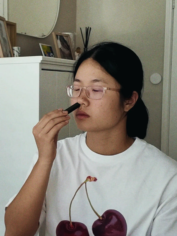 Inhale Club customer using a nasal inhaler
