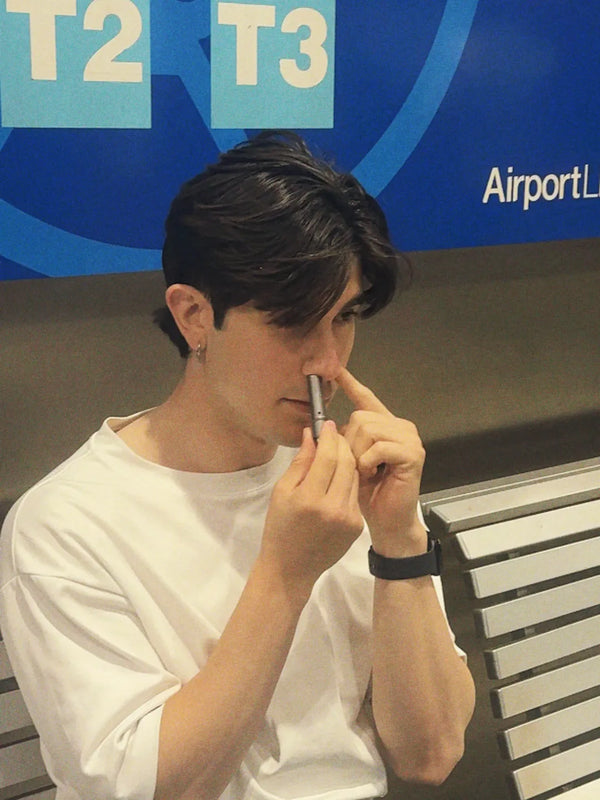Inhale Club customer using a nasal inhaler